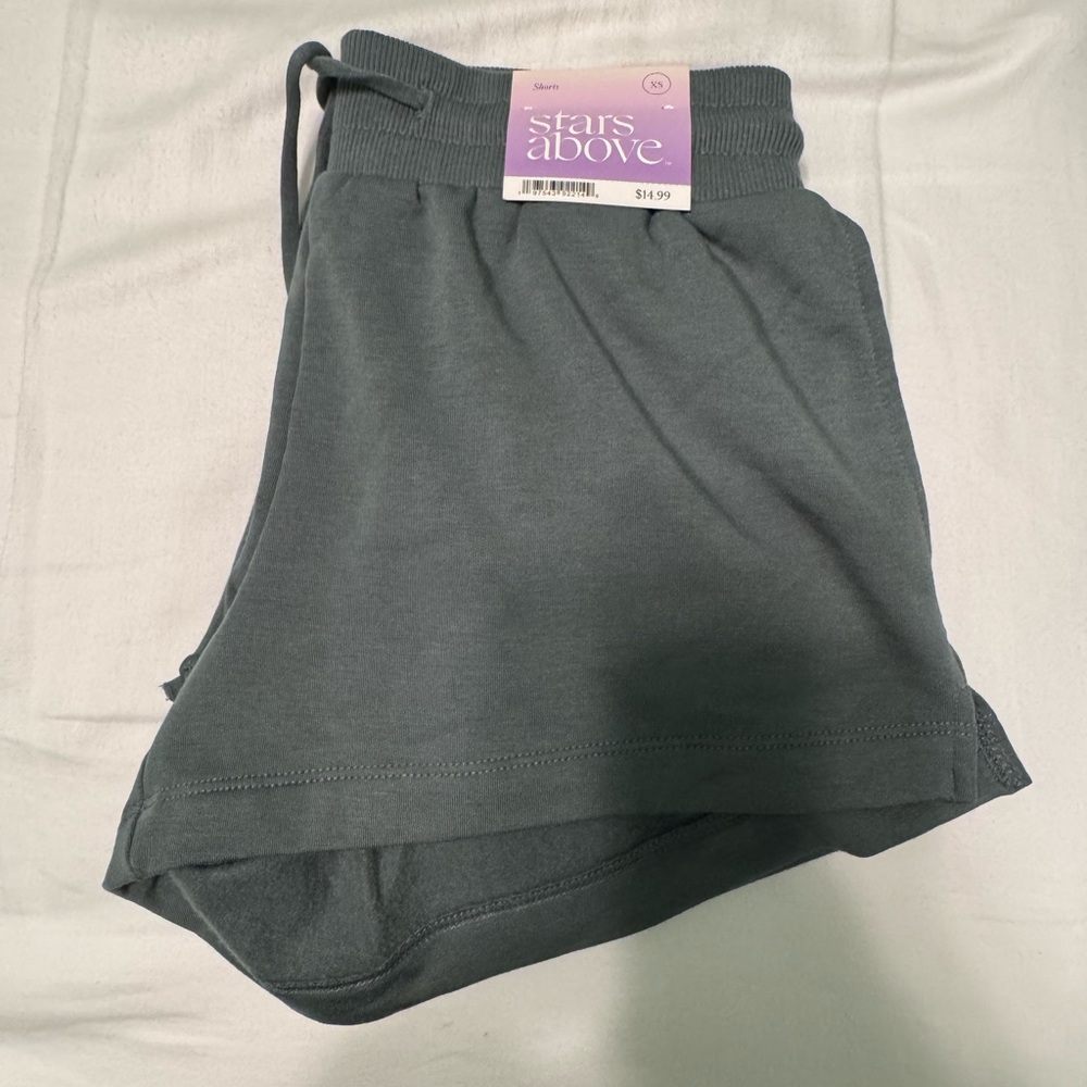 Stars above shorts never worn! Size XS